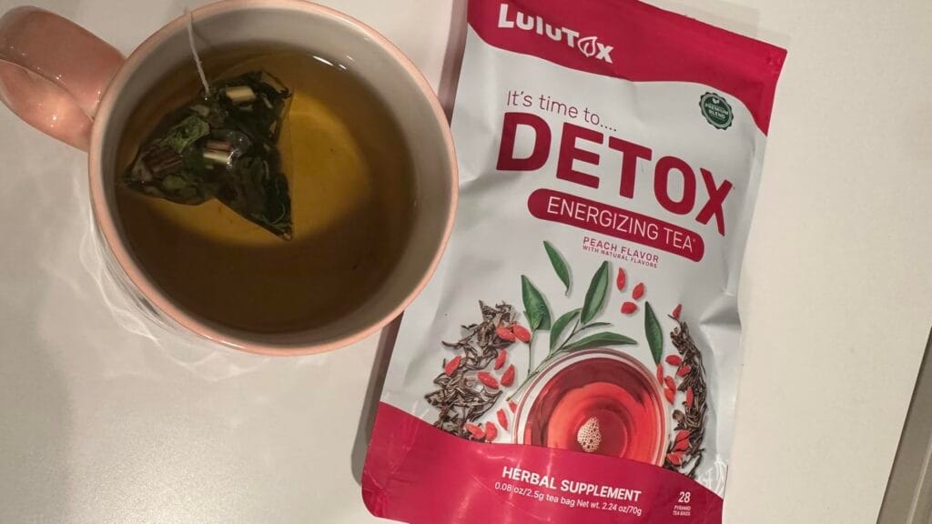 LULUTOX detox tea brewed in clear glass mug